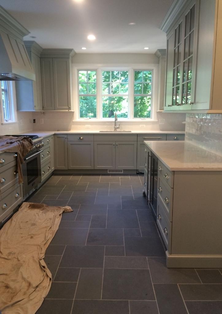 Rainbow Tile Kitchen with White Cabinets